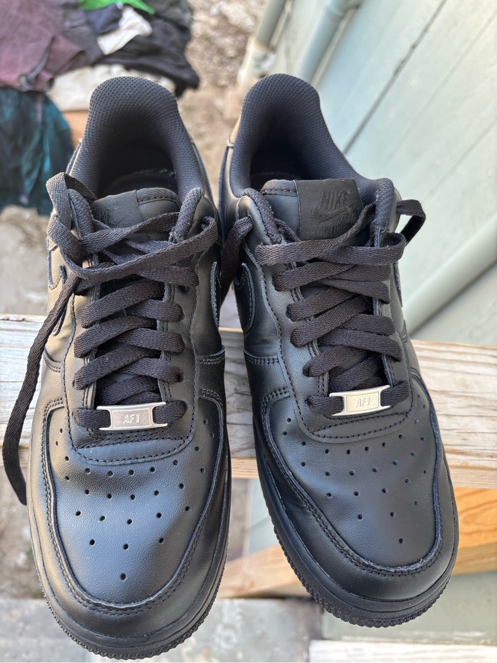 Nike Men’s All-Black Leather Sneakers